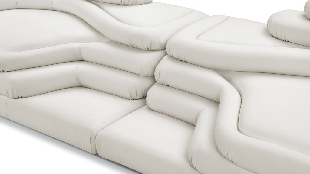 Terrazza Sofa in warm white vegan leather, embodying modern elegance and comfort.