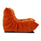 Ergonomic Togo fireside chair with signature pleated folds, offering ultimate relaxation.